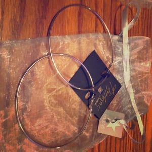 New. X-large silver hoop earrings. Never ever worn